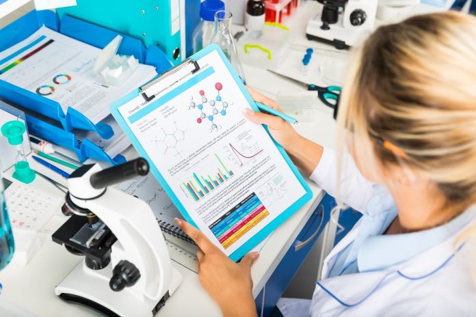 Young attractive woman scientist researching in the laboratory
