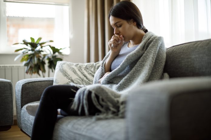 Ill woman coughing